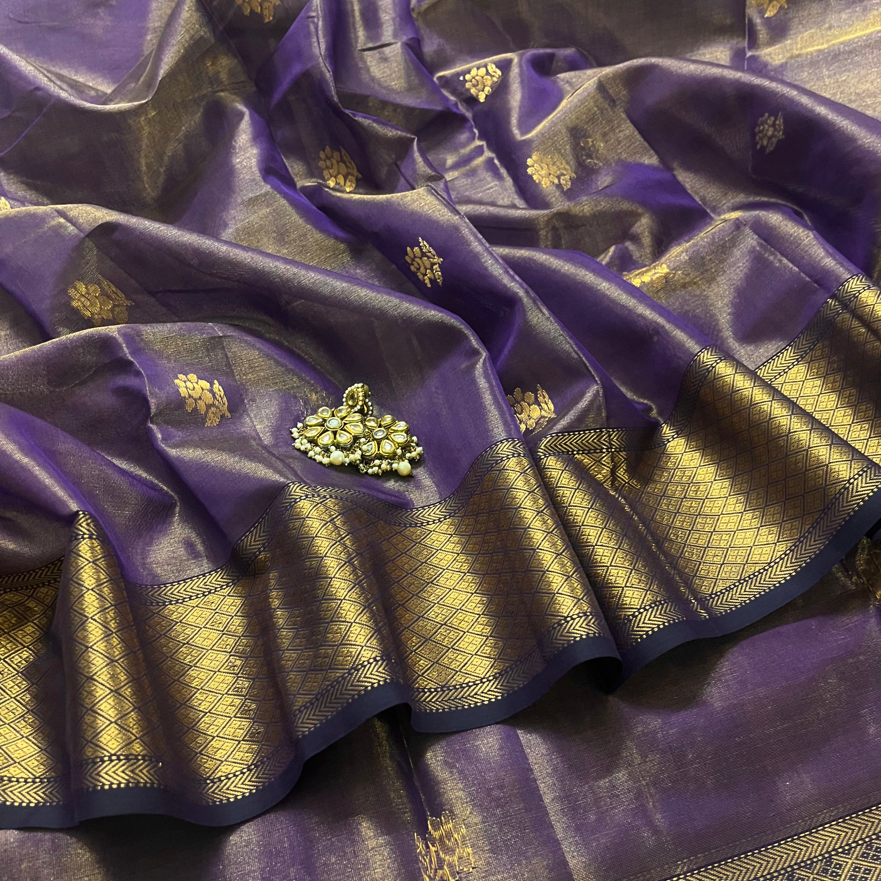 Dark purple maheshwari tissue silk saree with flower motifs all over