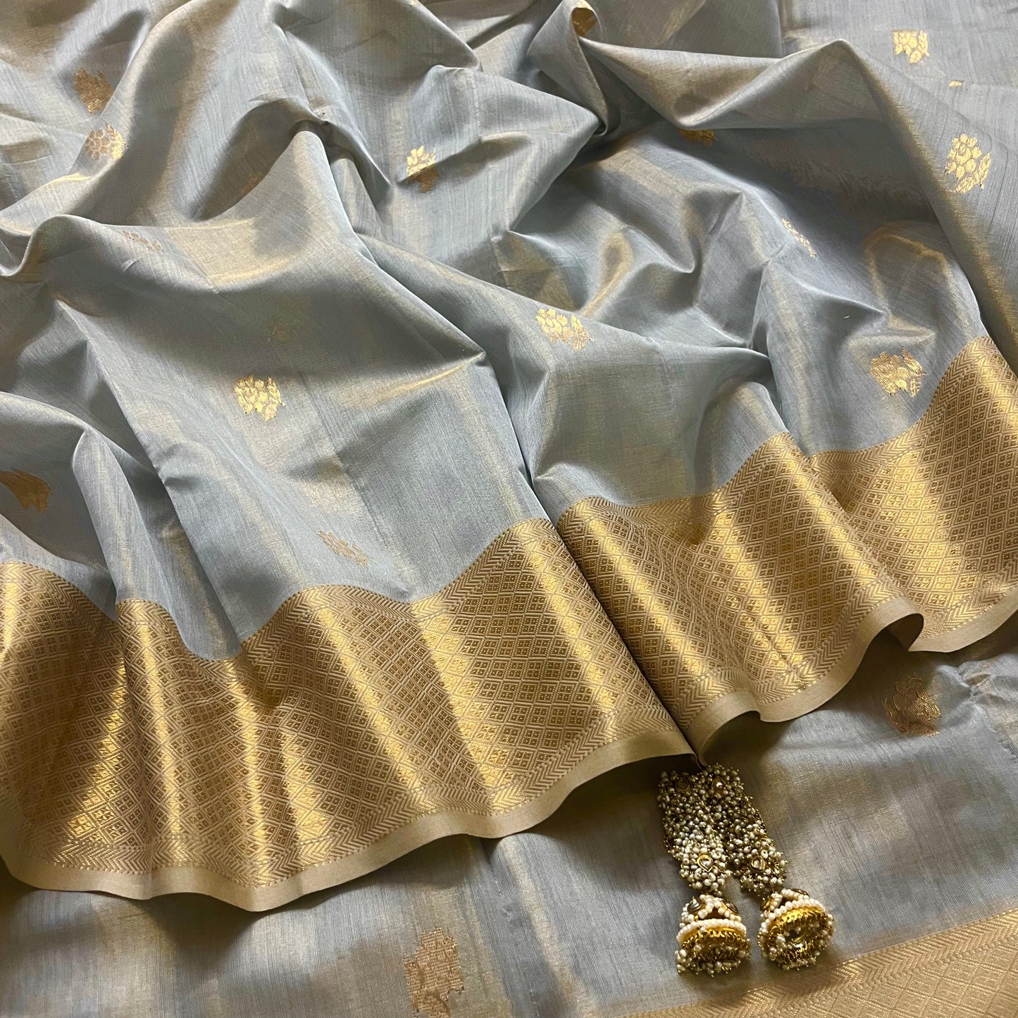 Grey gold maheshwari tissue silk saree with flower motifs all over
