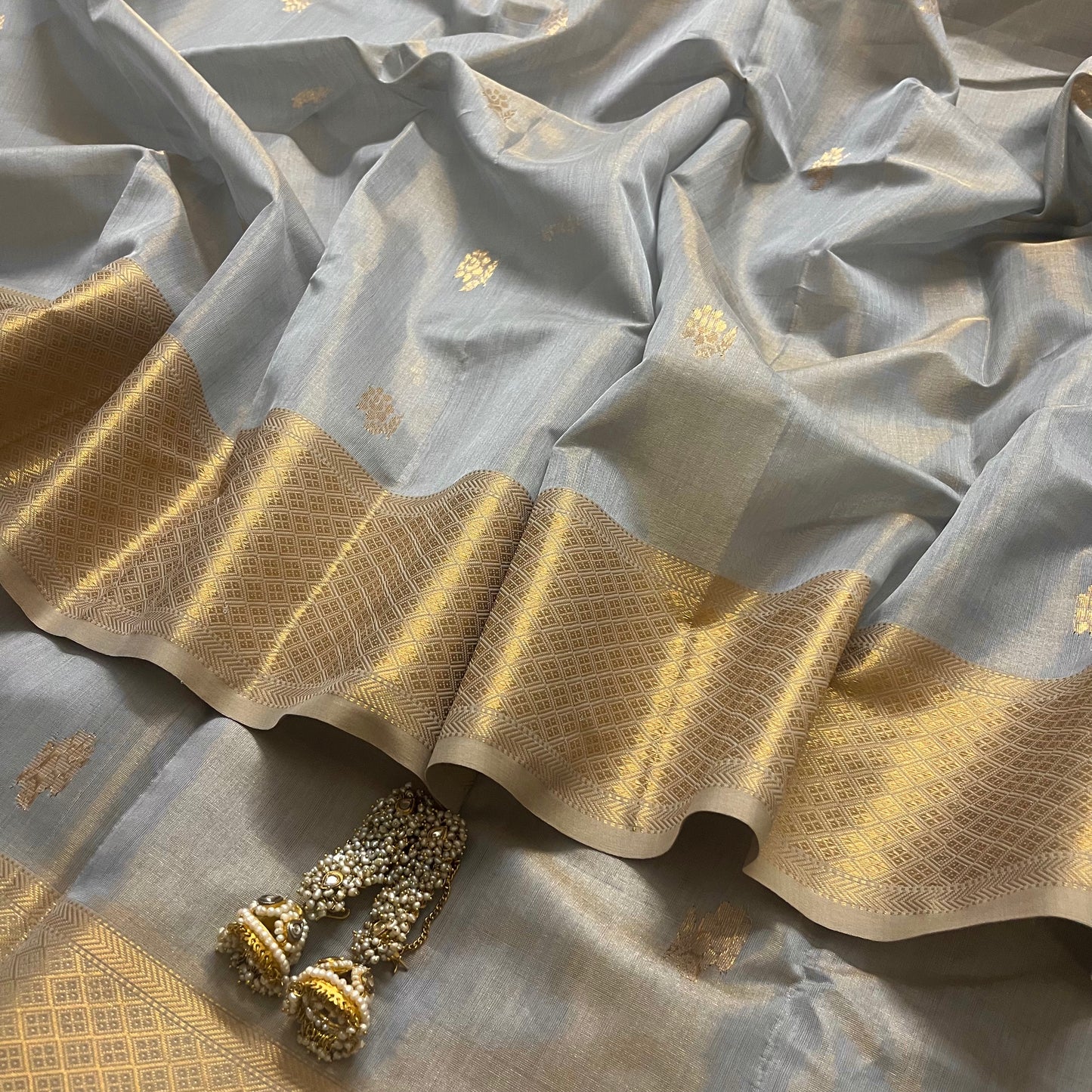 Grey gold maheshwari tissue silk saree with flower motifs all over