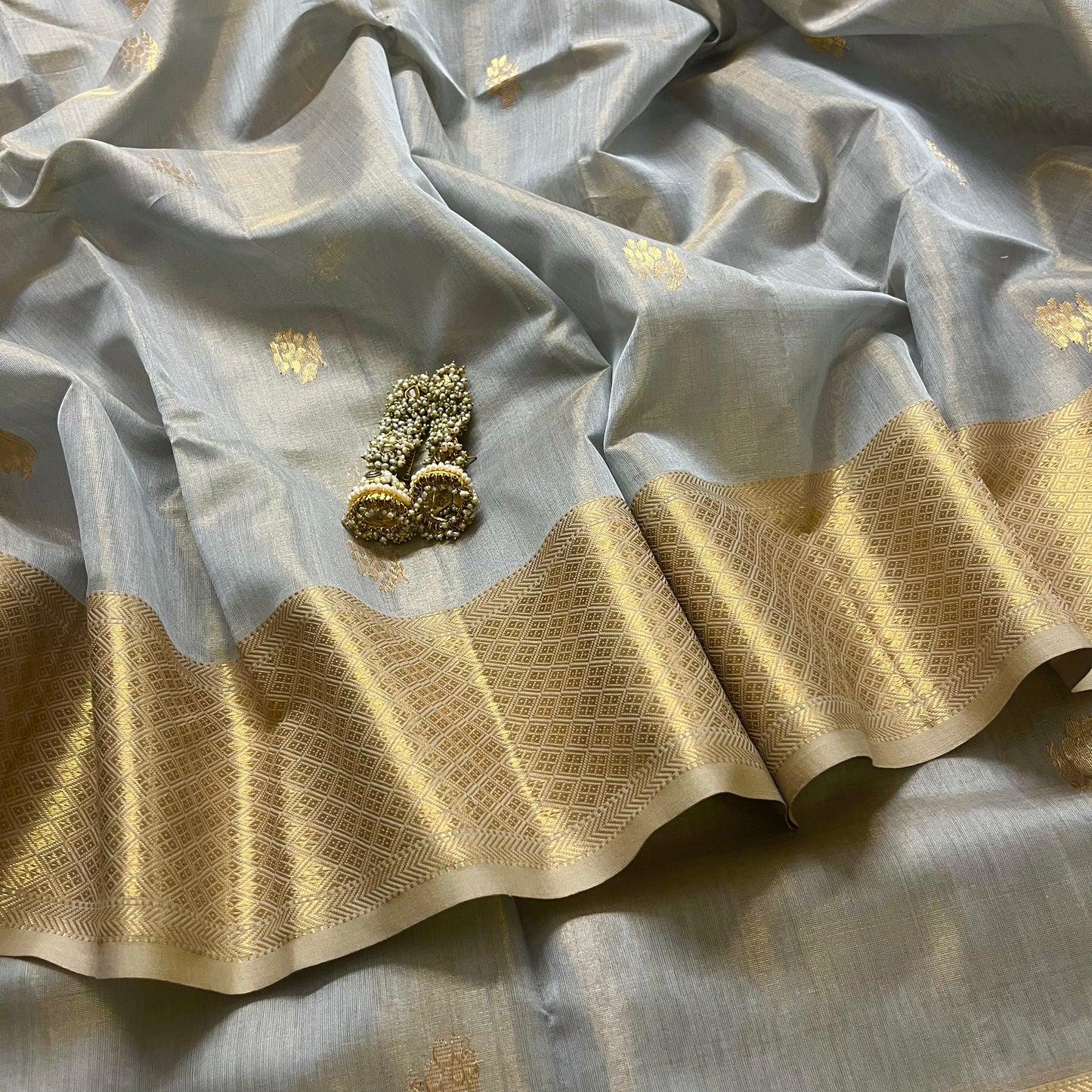 Grey gold maheshwari tissue silk saree with flower motifs all over