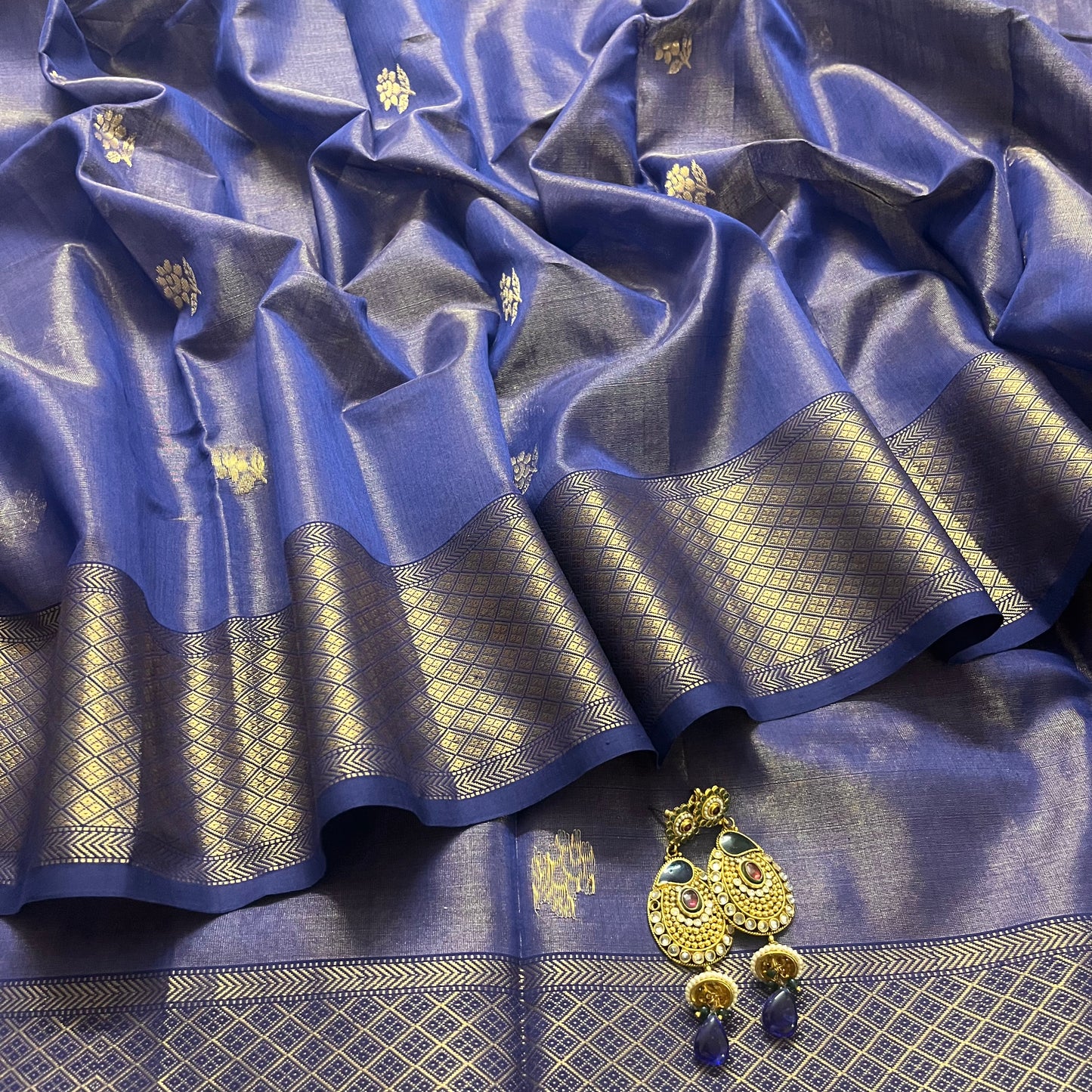 Dark blue maheshwari tissue silk saree with flower motifs all over