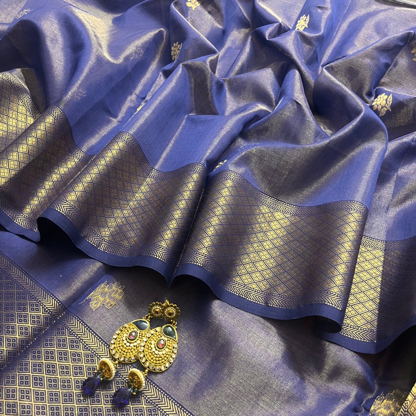 Dark blue maheshwari tissue silk saree with flower motifs all over