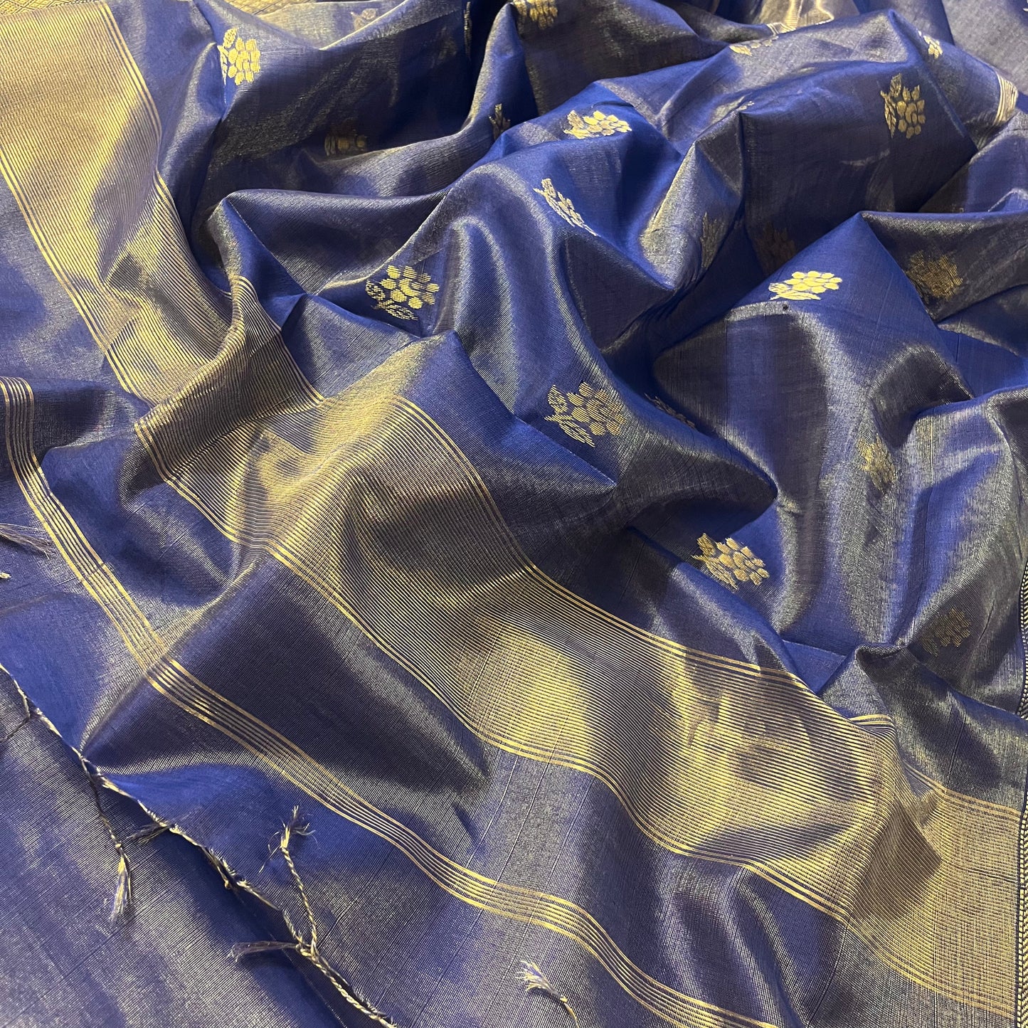 Dark blue maheshwari tissue silk saree with flower motifs all over