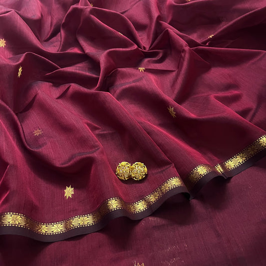 Maroon and black maheshwari saree with flower bootis all over