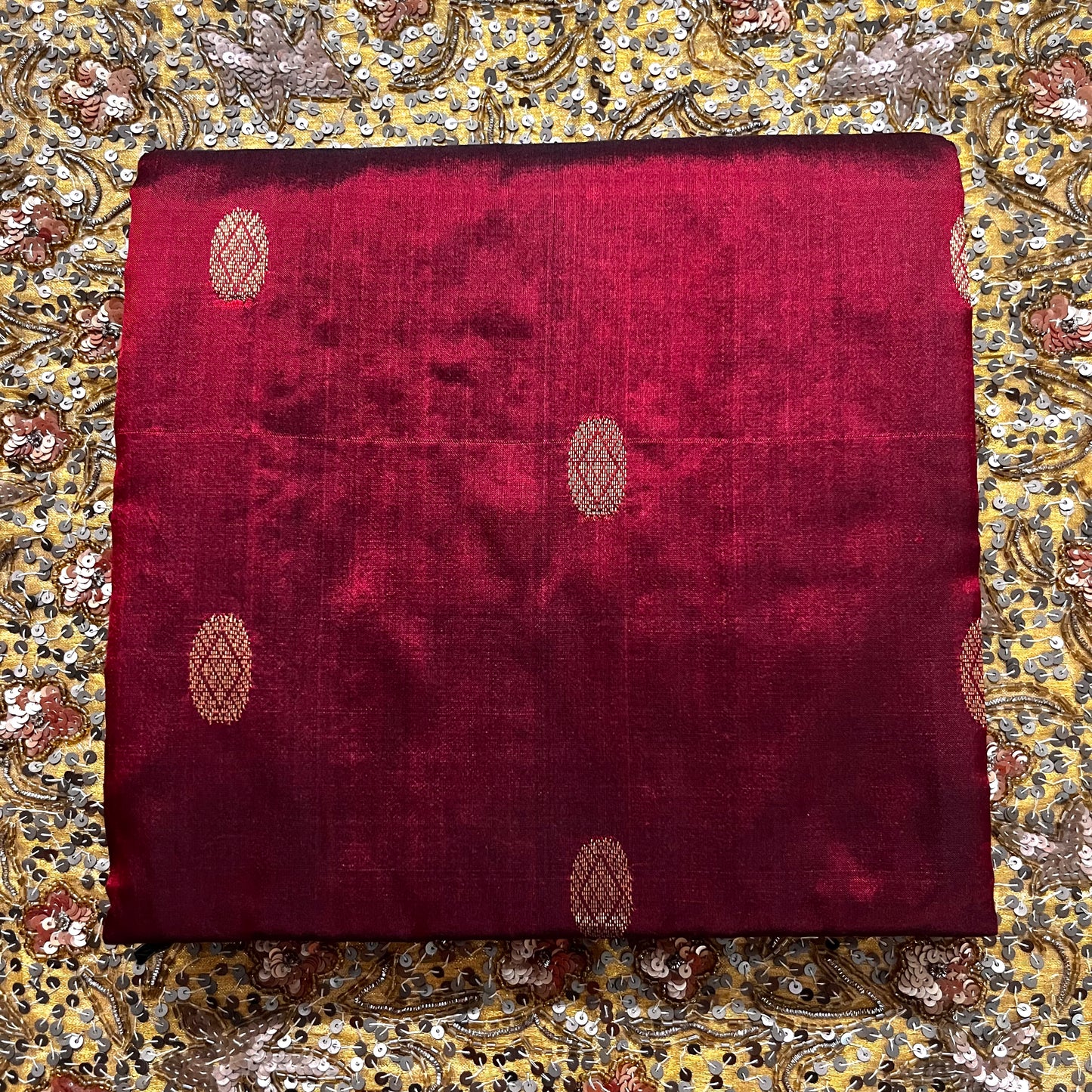 Deep maroon Maheshwari silk saree with zari bootis all over