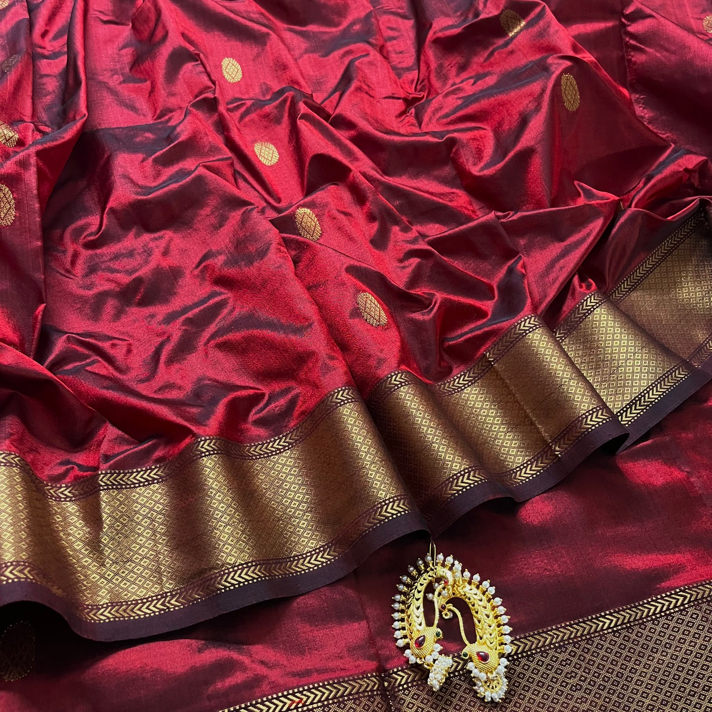Deep maroon Maheshwari silk saree with zari bootis all over