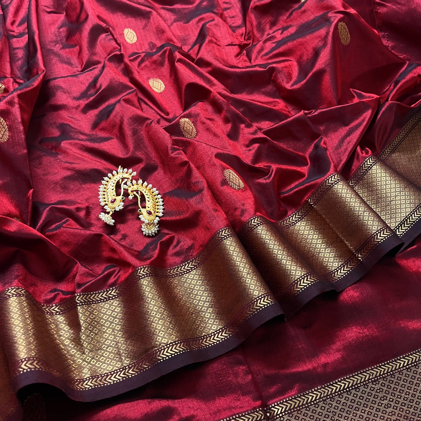 Deep maroon Maheshwari silk saree with zari bootis all over