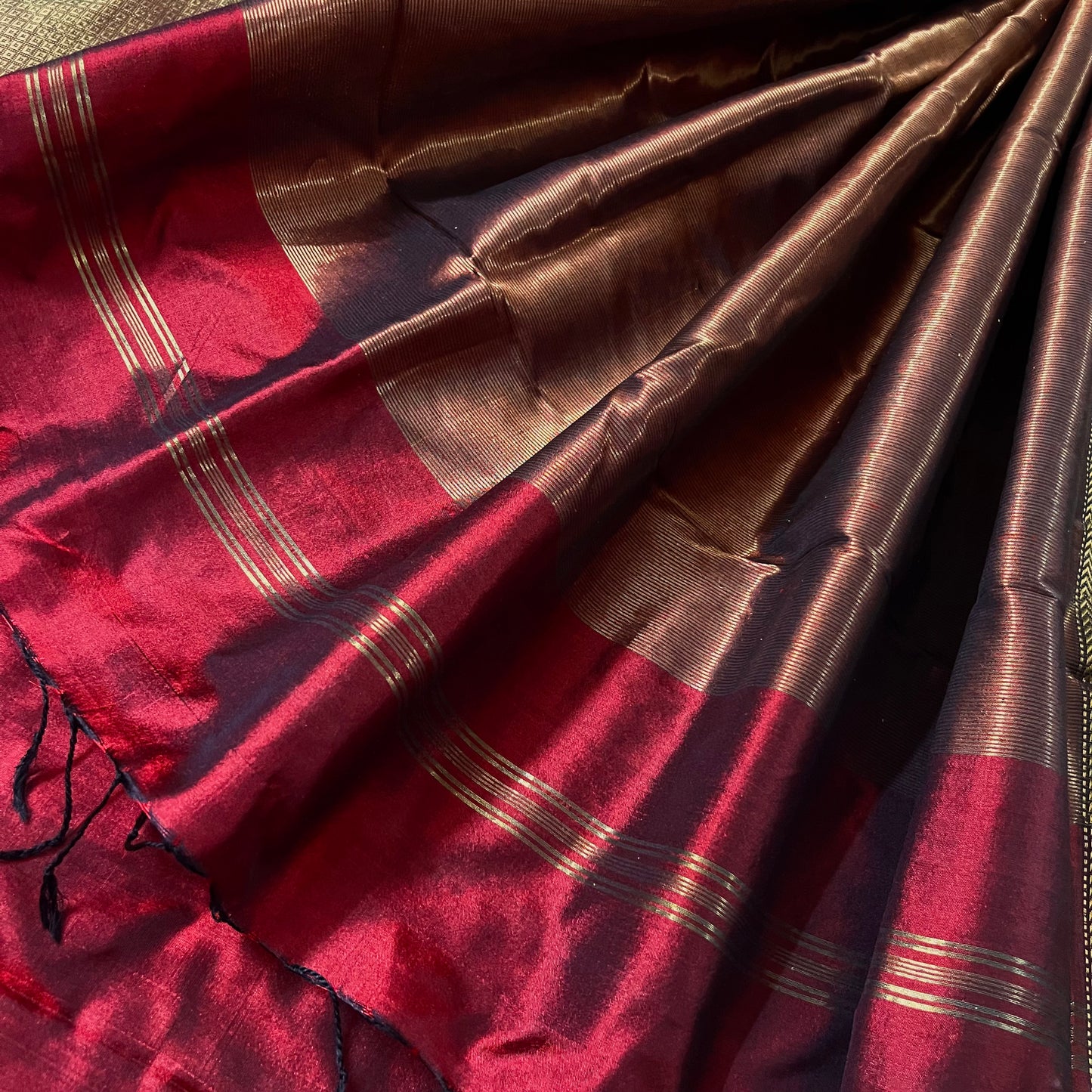 Deep maroon Maheshwari silk saree with zari bootis all over
