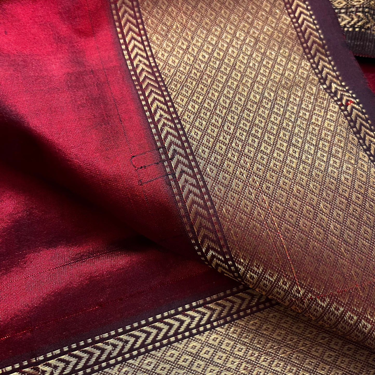 Deep maroon Maheshwari silk saree with zari bootis all over