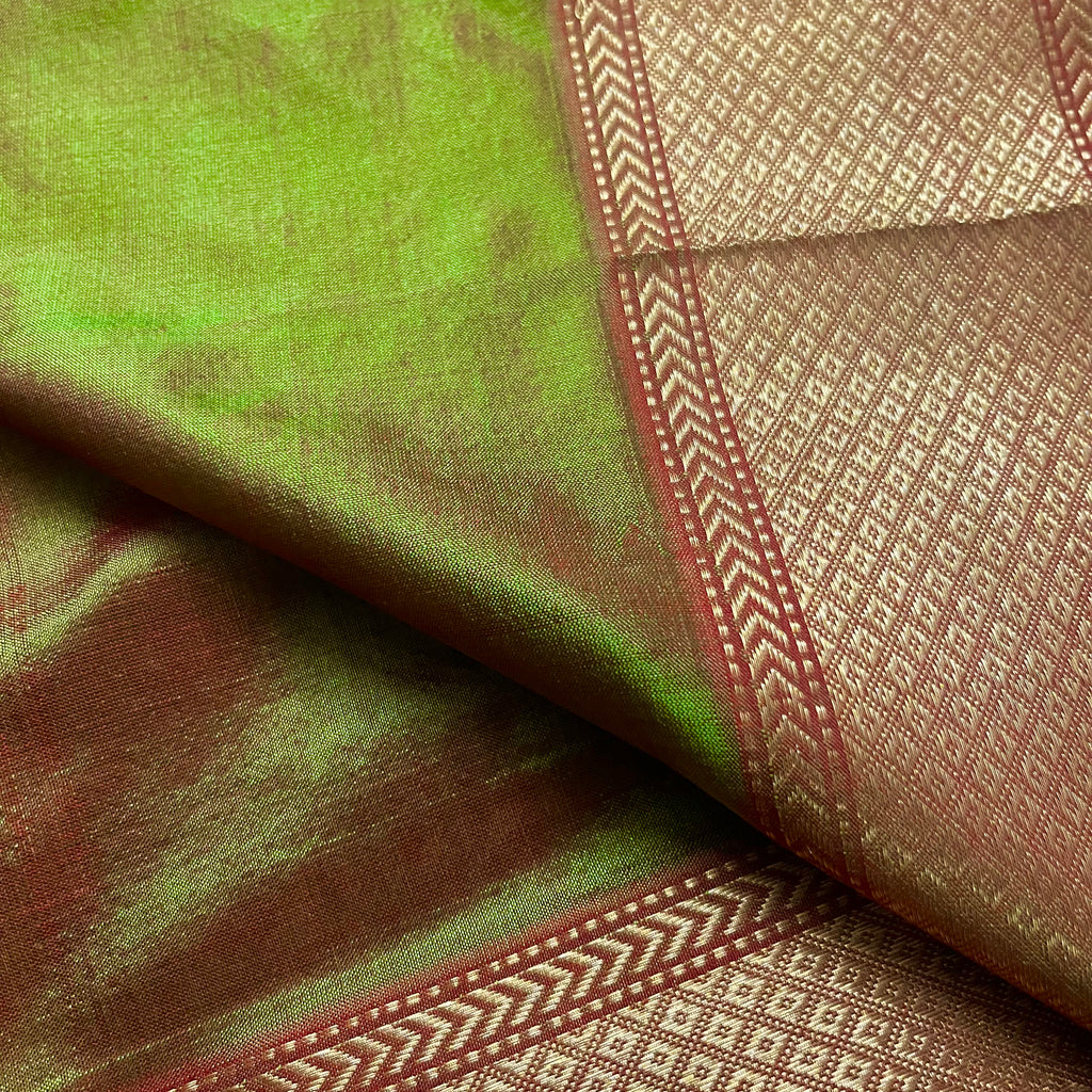 Olive green and red Maheshwari silk saree with zari bootis all over