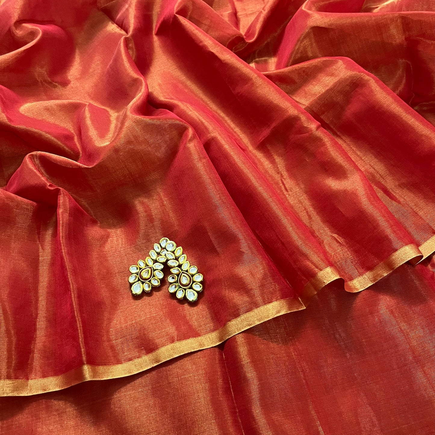 Red Maheshwari tissue silk saree with zari lines on pallu