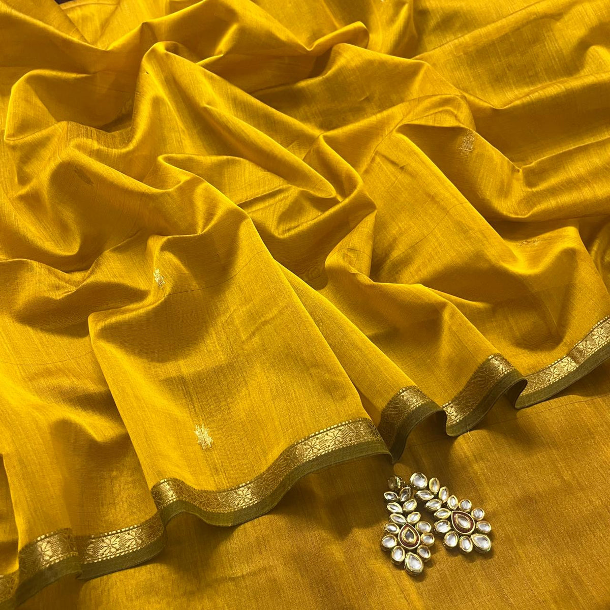 Mustard and pink maheshwari saree with flower bootis all over
