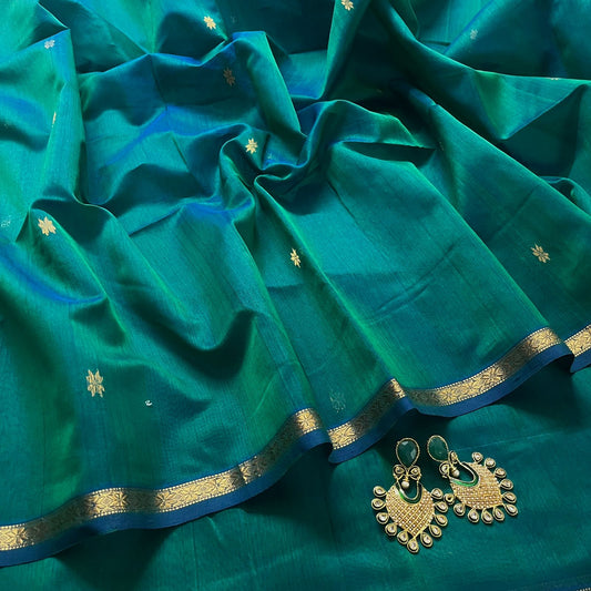 Peacock green dual tone maheshwari saree with flower bootis all over