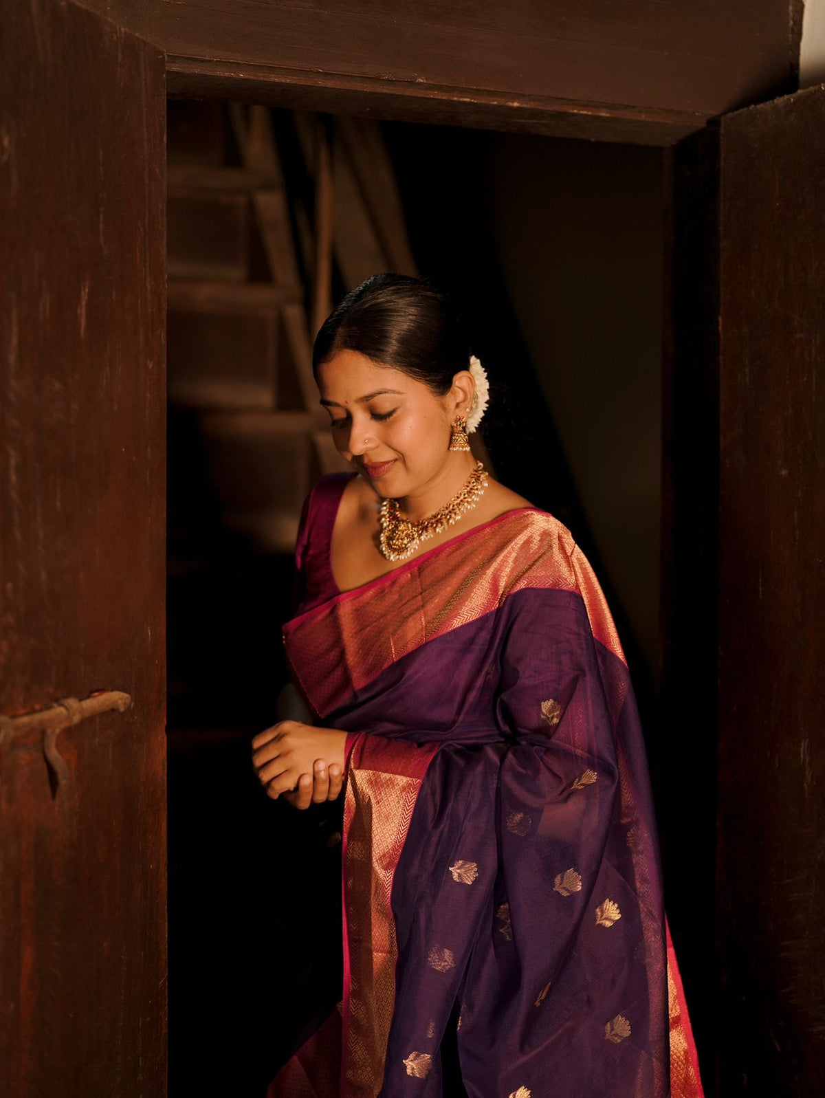 Dark purple and pink maheshwari saree with flower motifs all over
