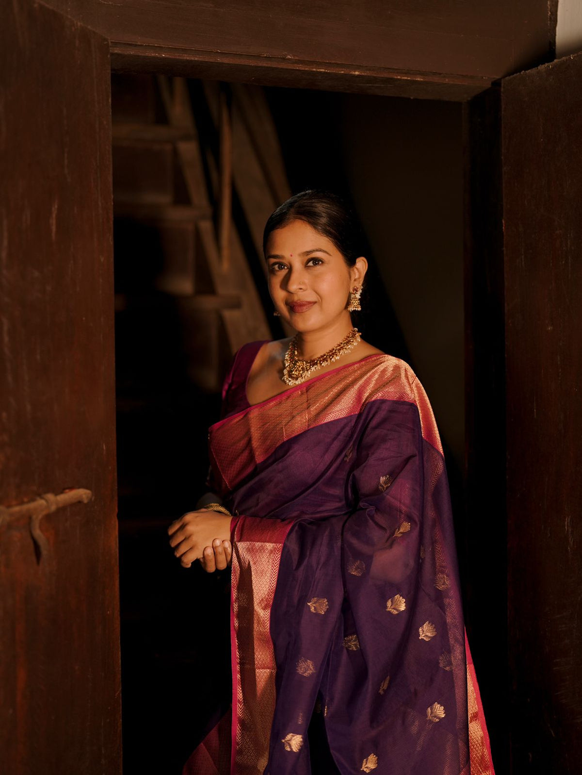 Dark purple and pink maheshwari saree with flower motifs all over