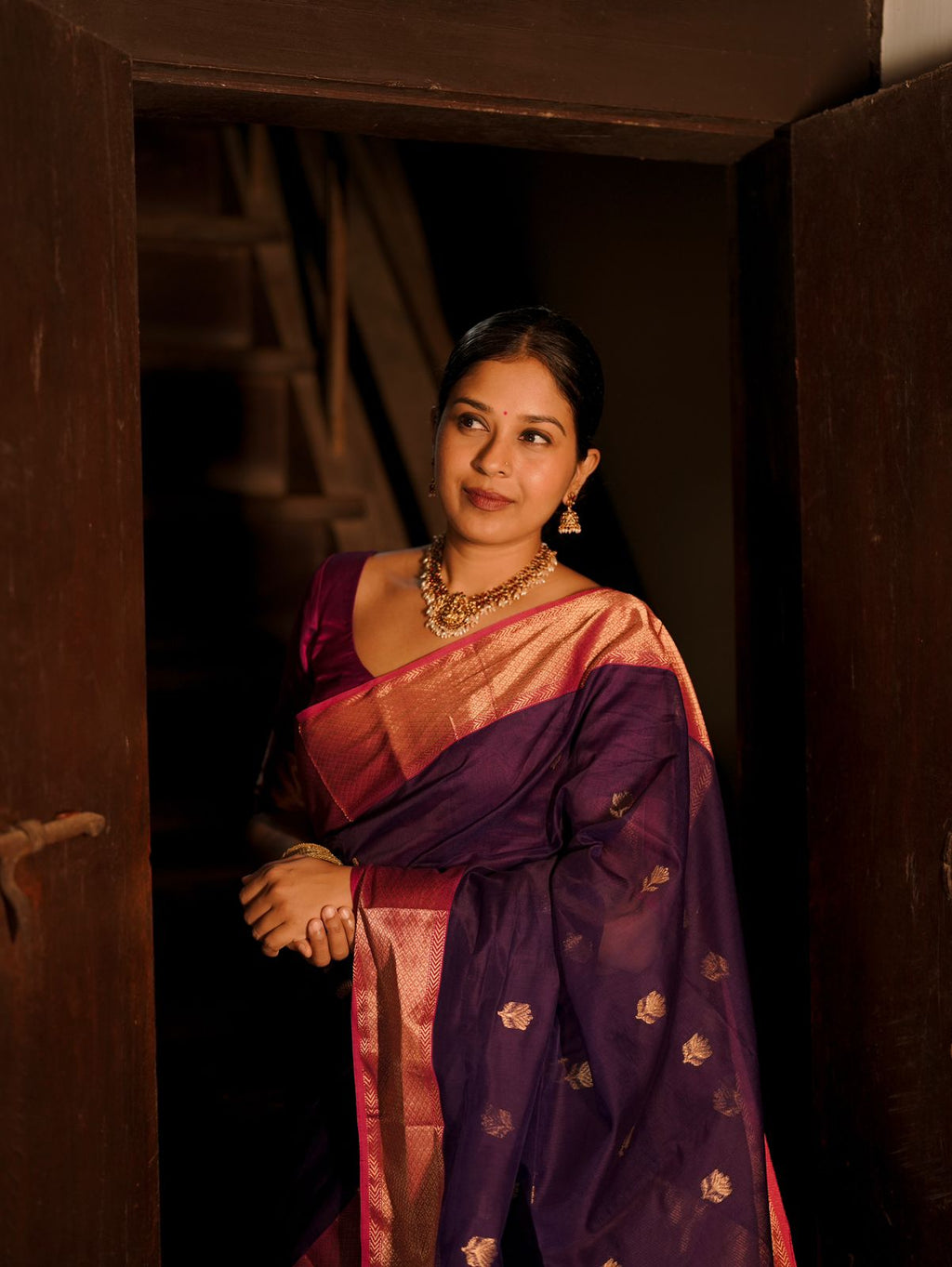 Dark purple and pink maheshwari saree with flower motifs all over