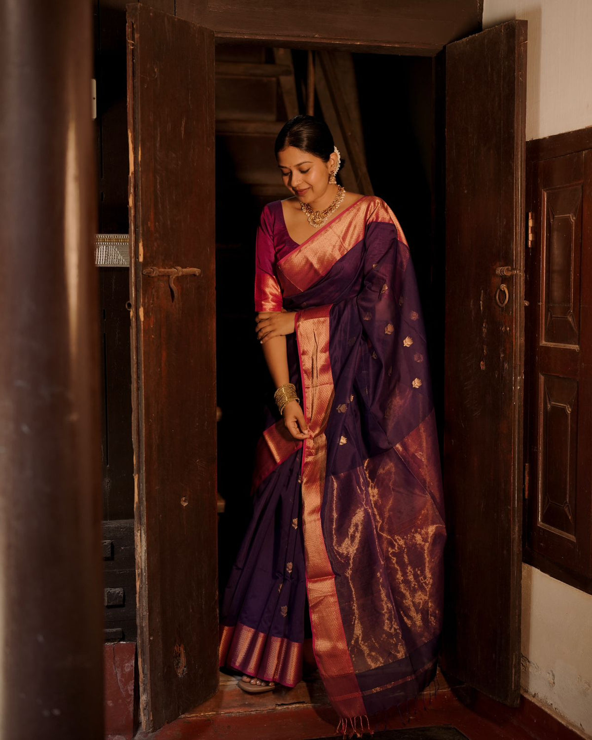 Dark purple and pink maheshwari saree with flower motifs all over