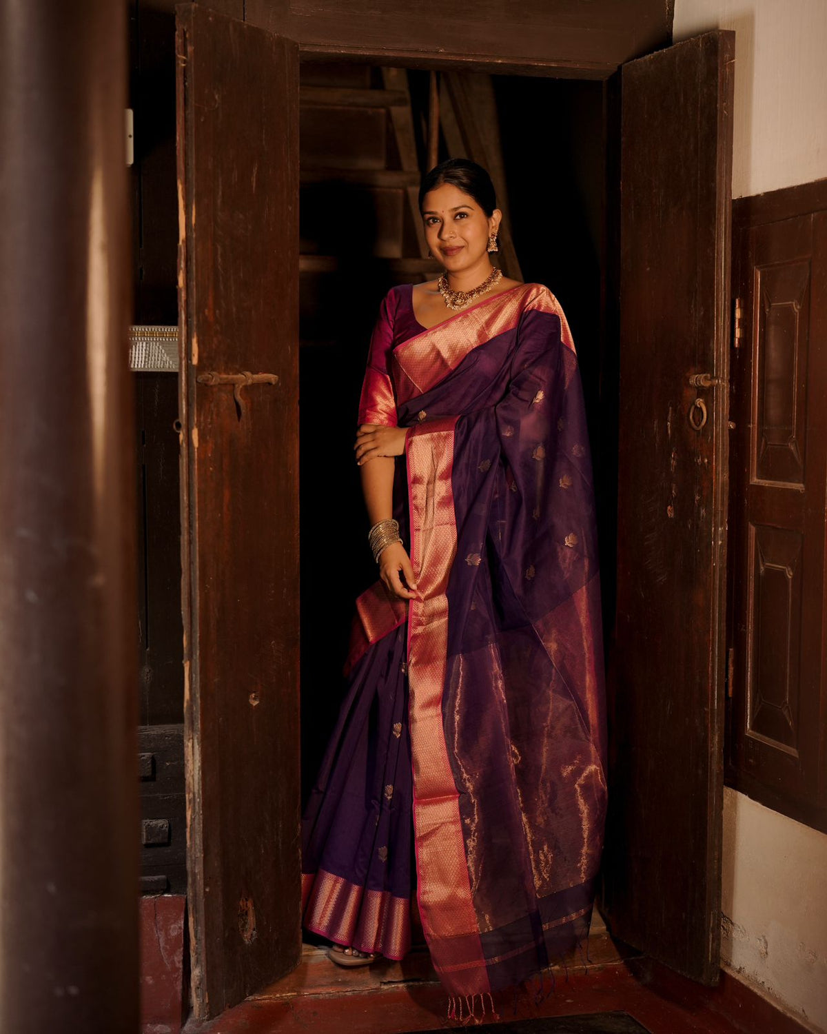 Dark purple and pink maheshwari saree with flower motifs all over