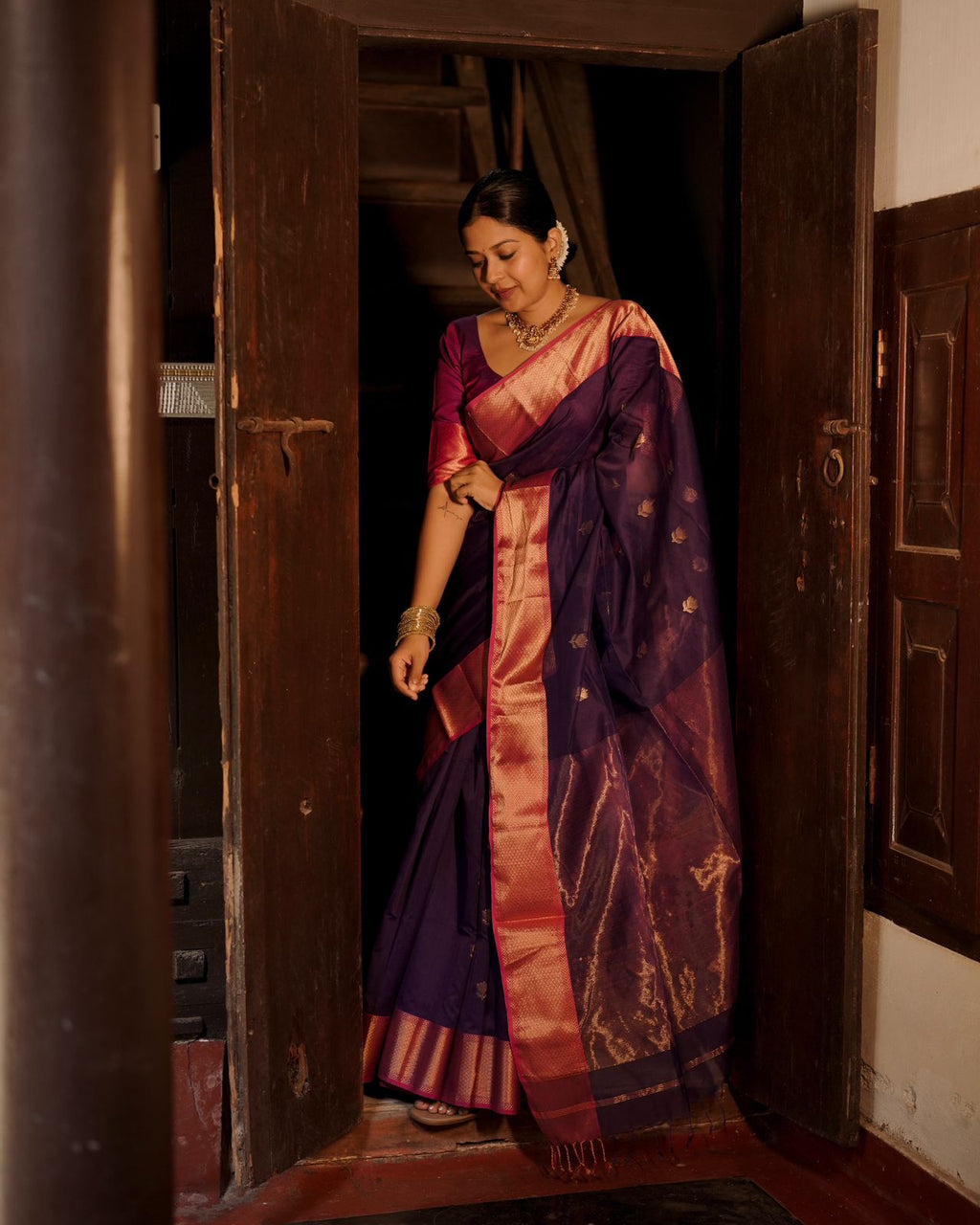 Dark purple and pink maheshwari saree with flower motifs all over