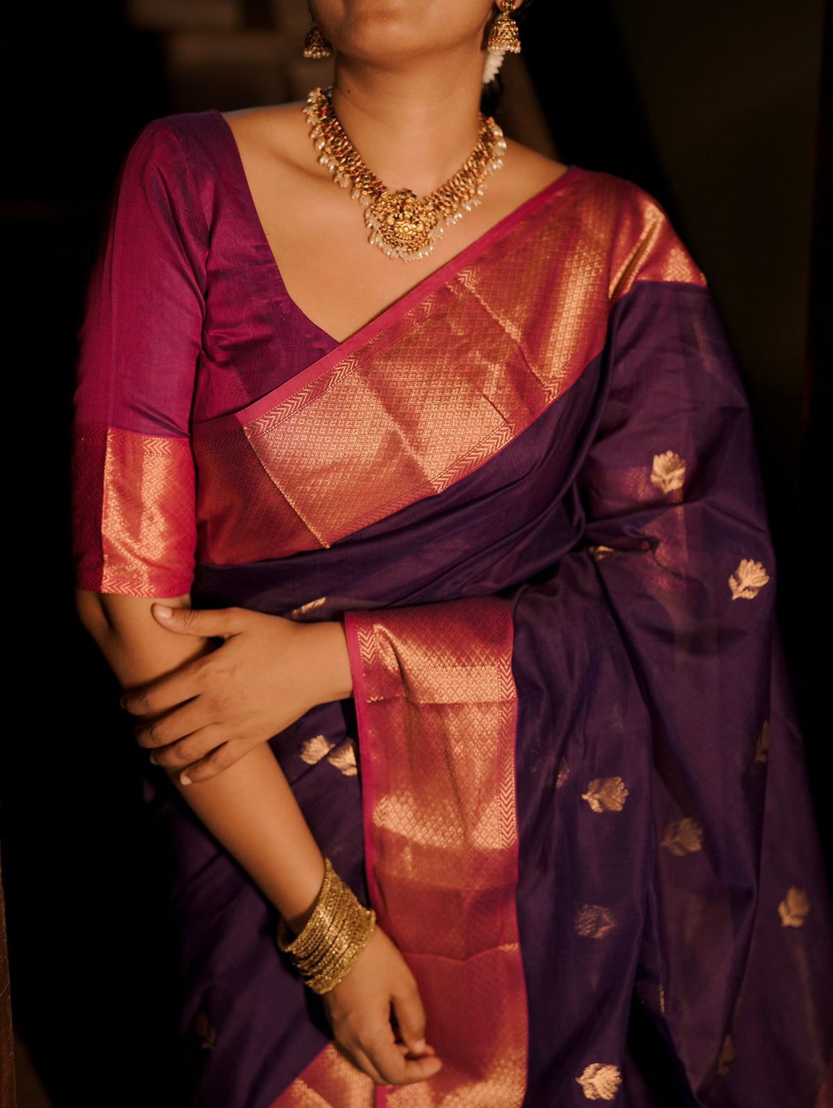 Dark purple and pink maheshwari saree with flower motifs all over