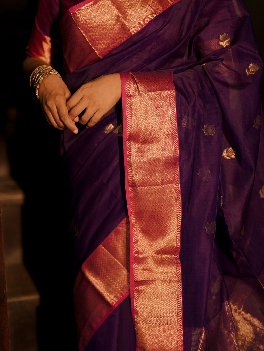 Dark purple and pink maheshwari saree with flower motifs all over