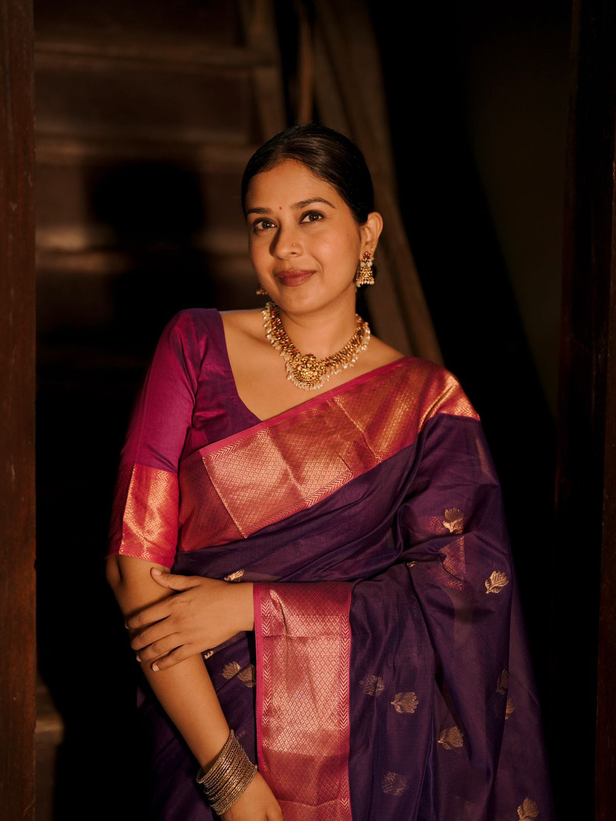Dark purple and pink maheshwari saree with flower motifs all over