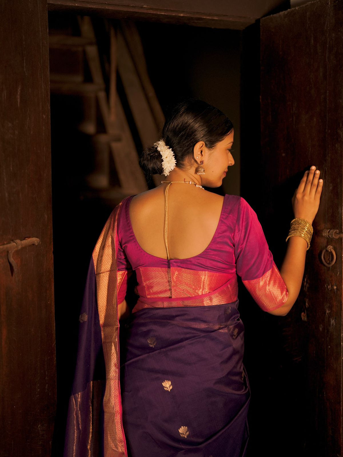 Dark purple and pink maheshwari saree with flower motifs all over