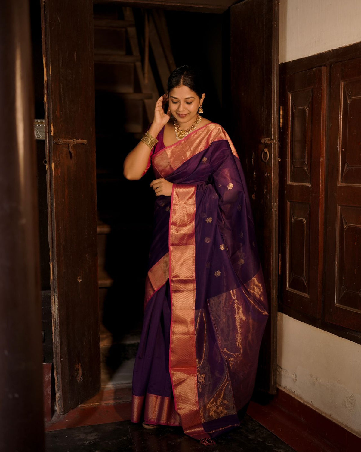 Dark purple and pink maheshwari saree with flower motifs all over