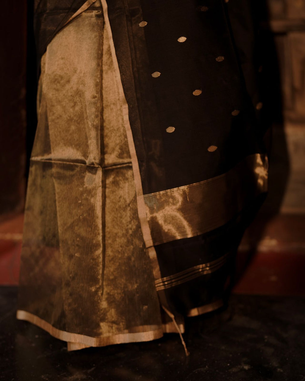 Black and gold maheshwari saree with zari bootis and zari lines all over