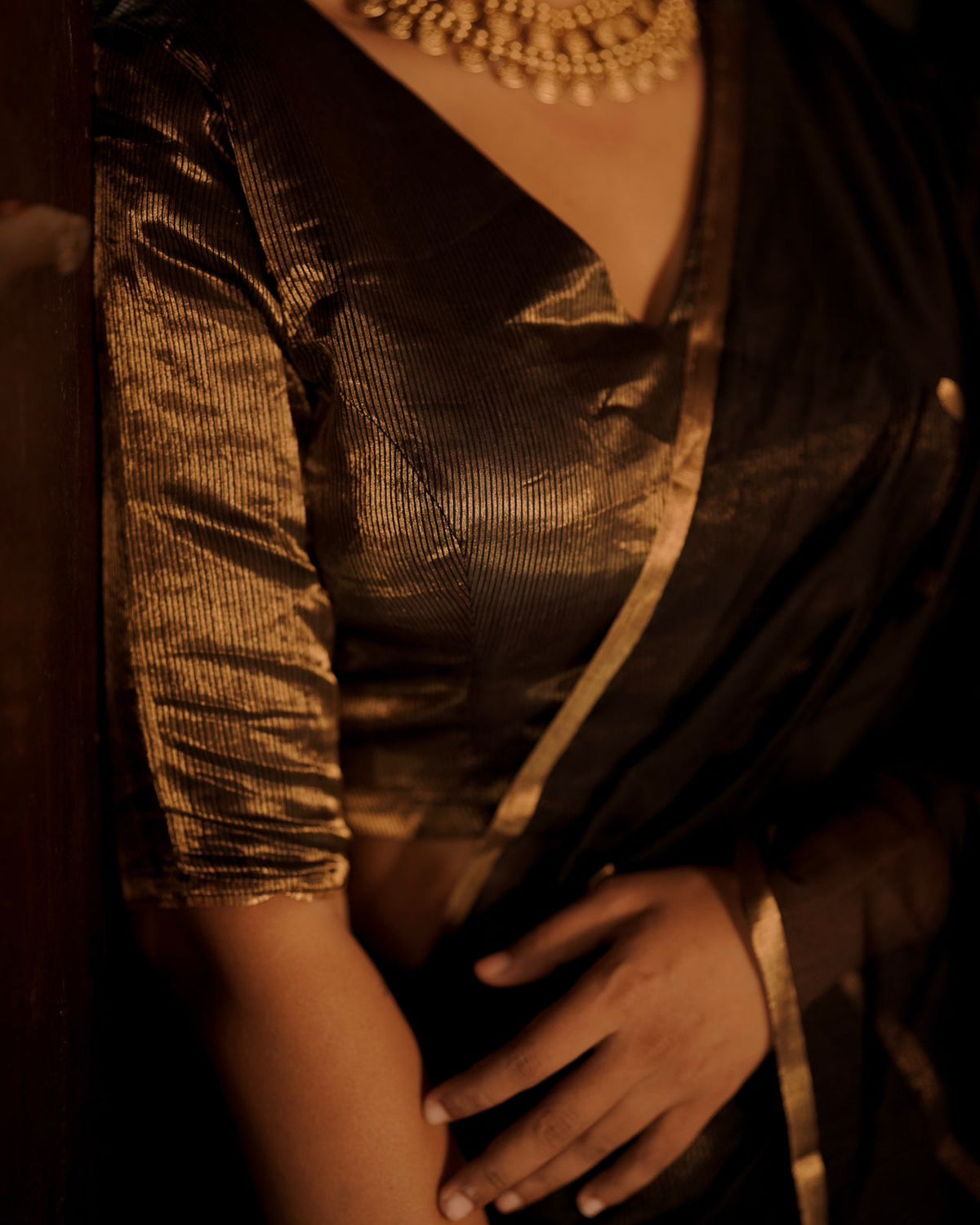 Black and gold maheshwari saree with zari bootis and zari lines all over