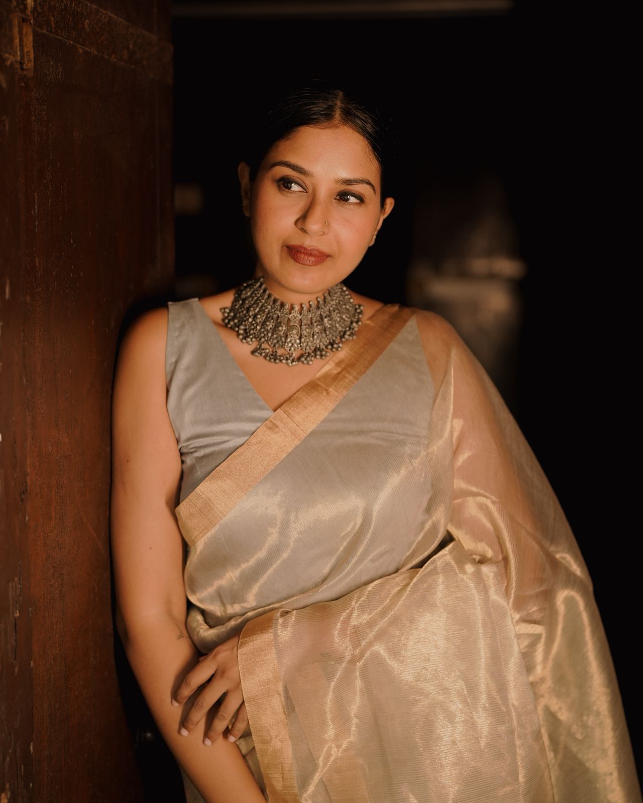 Grey and gold Maheshwari saree with zari lines all over