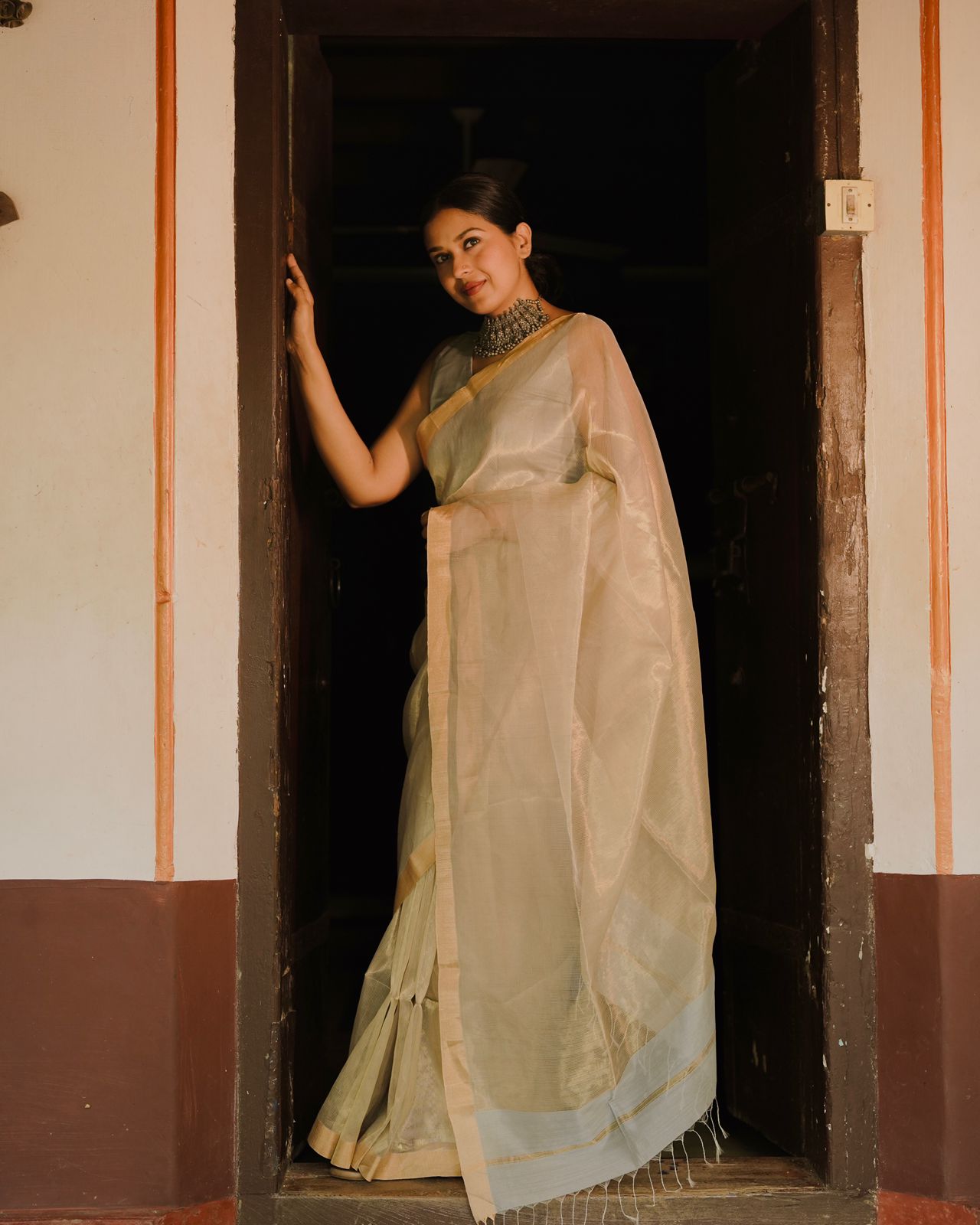 Grey and gold Maheshwari saree with zari lines all over