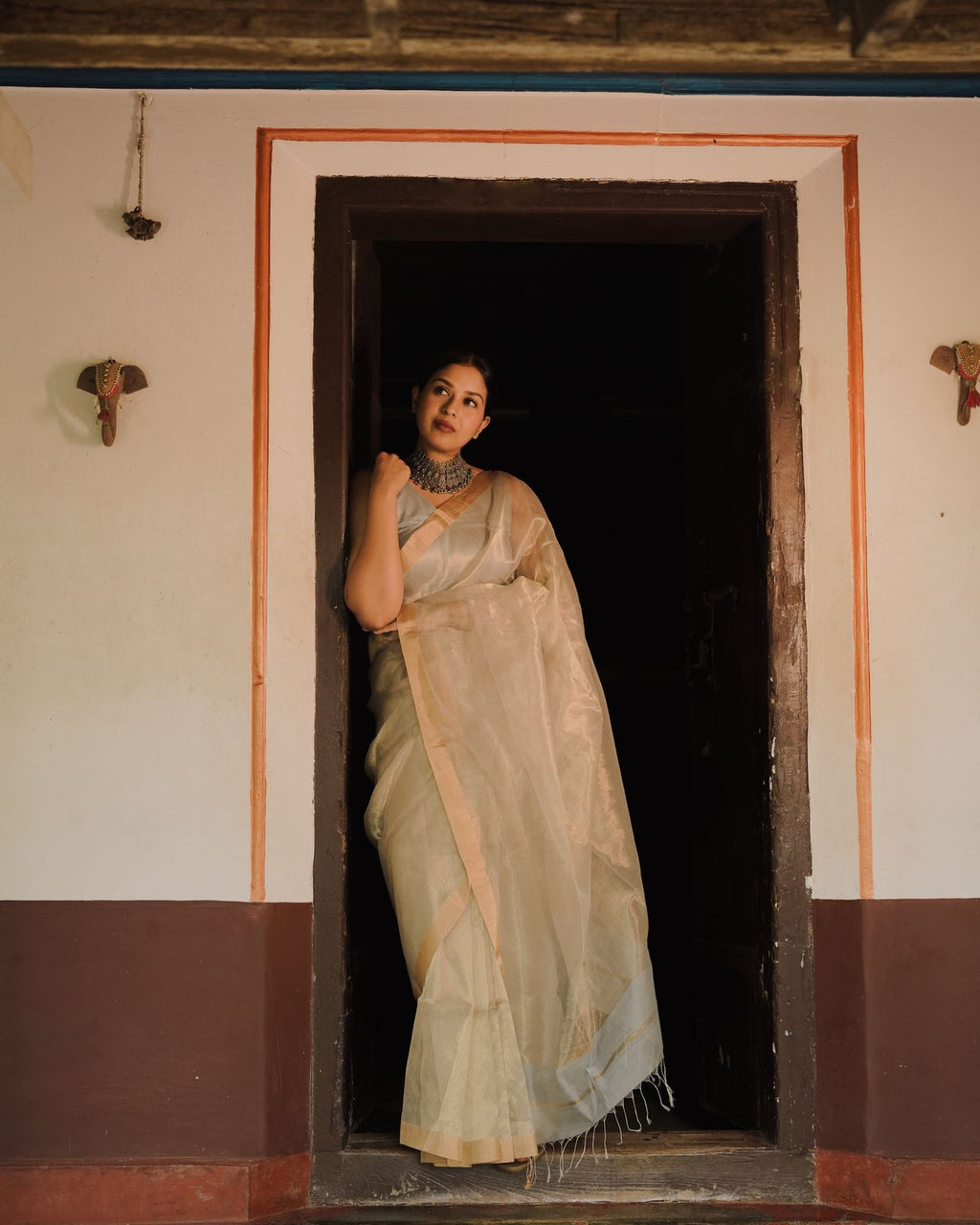 Grey and gold Maheshwari saree with zari lines all over