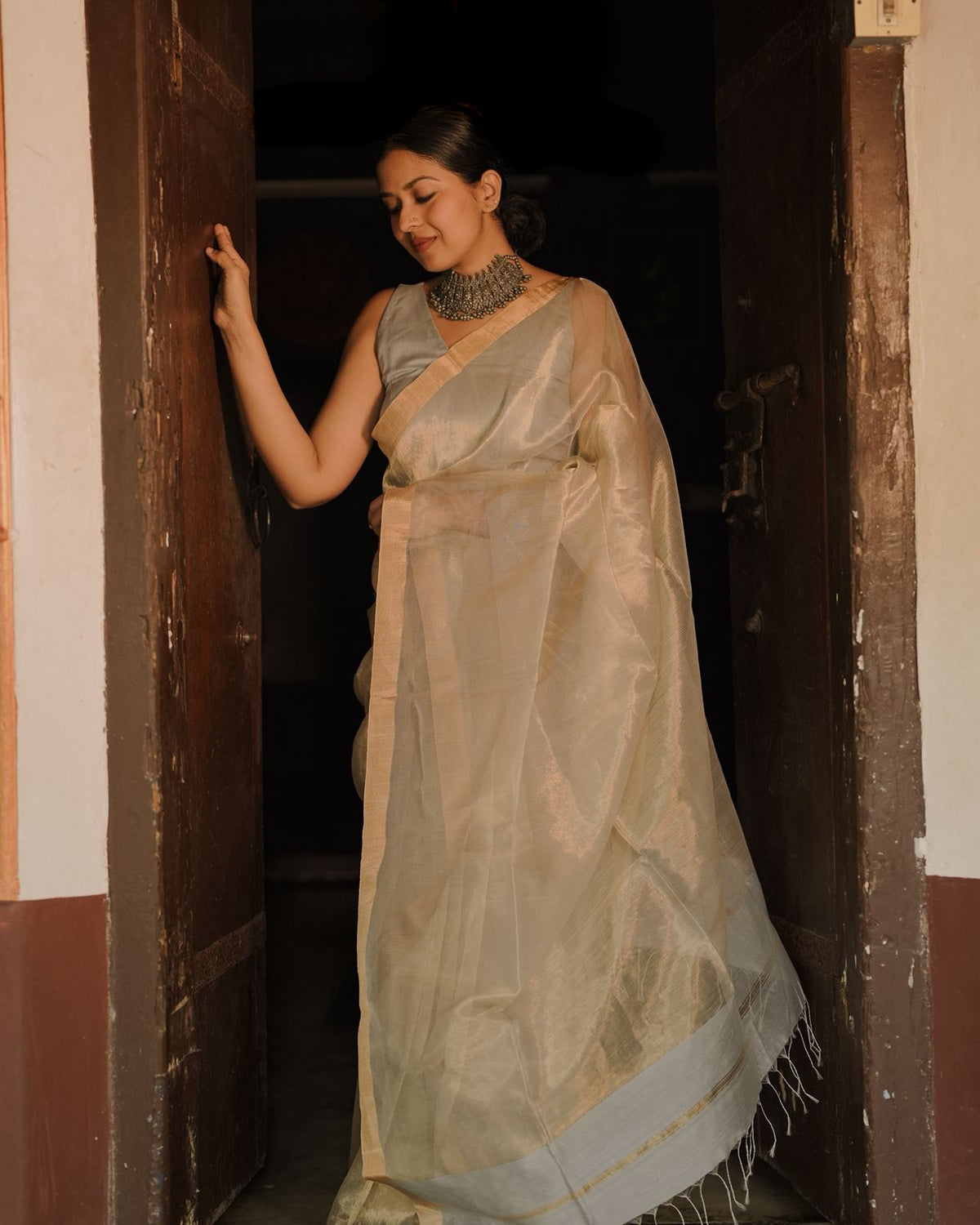Grey and gold Maheshwari saree with zari lines all over