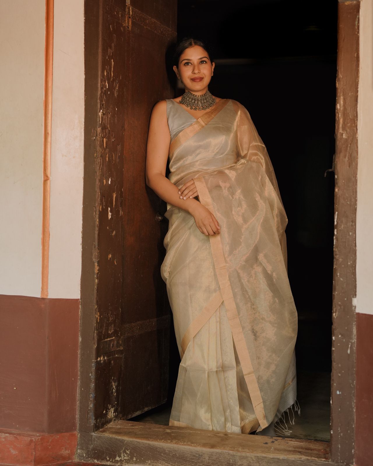 Grey and gold Maheshwari saree with zari lines all over