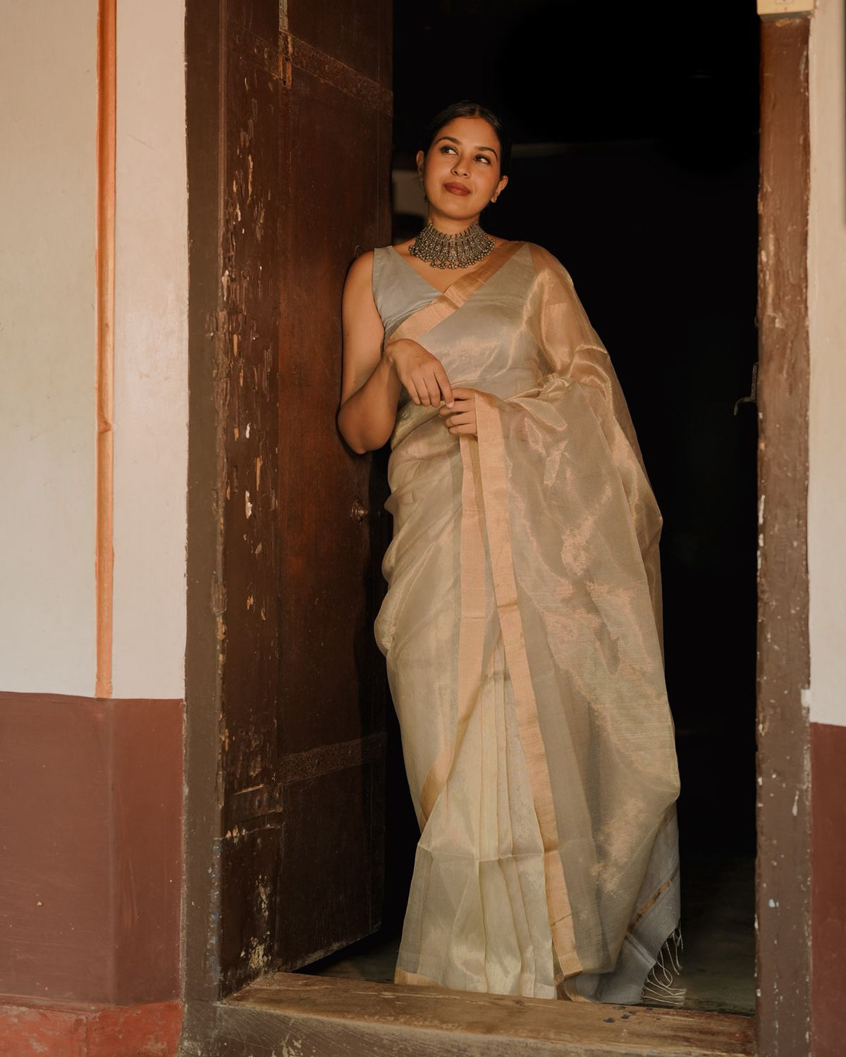 Grey and gold Maheshwari saree with zari lines all over