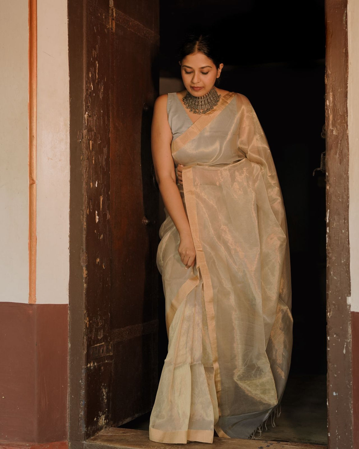 Grey and gold Maheshwari saree with zari lines all over