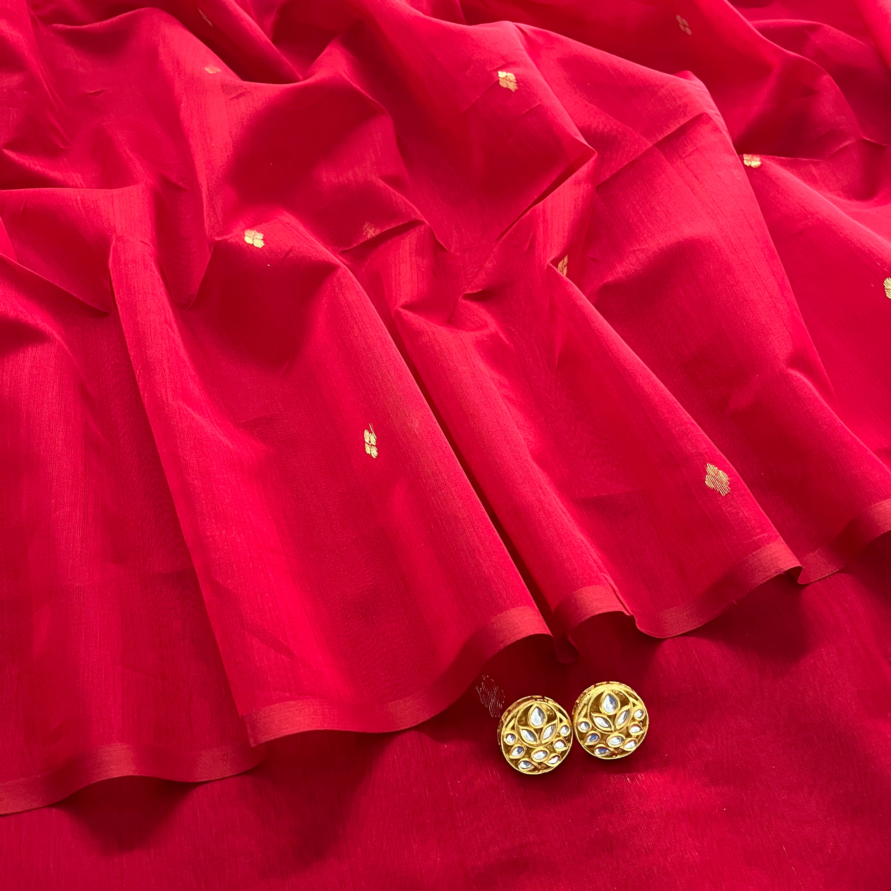 Deep red maheshwari saree with zari bootis all over